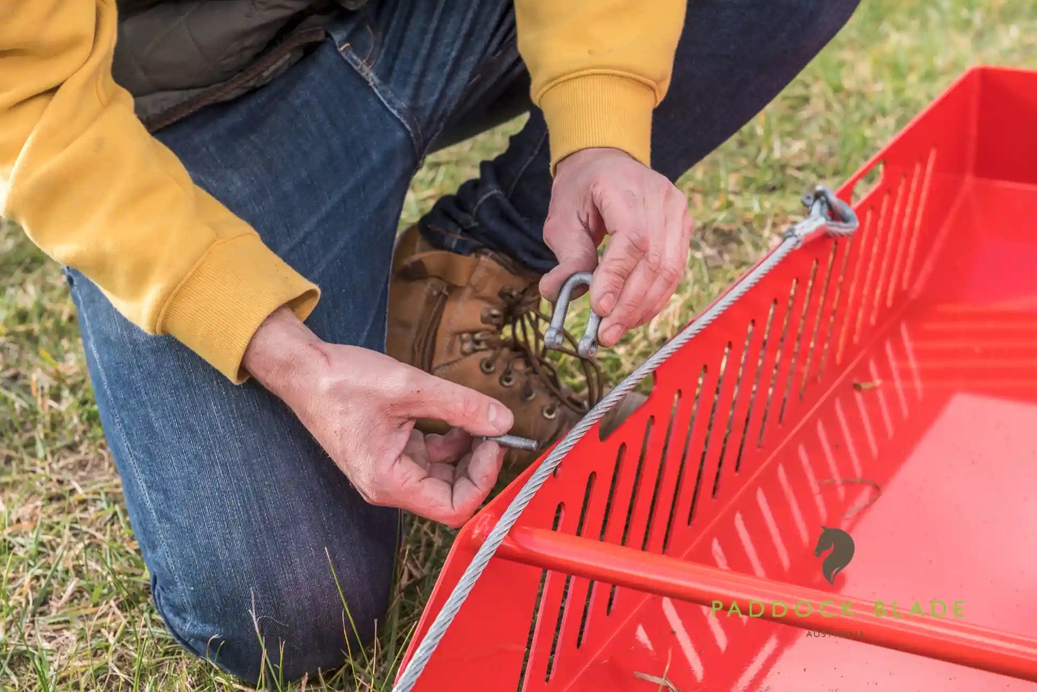 removing a shackle from a paddock pasture cleaner